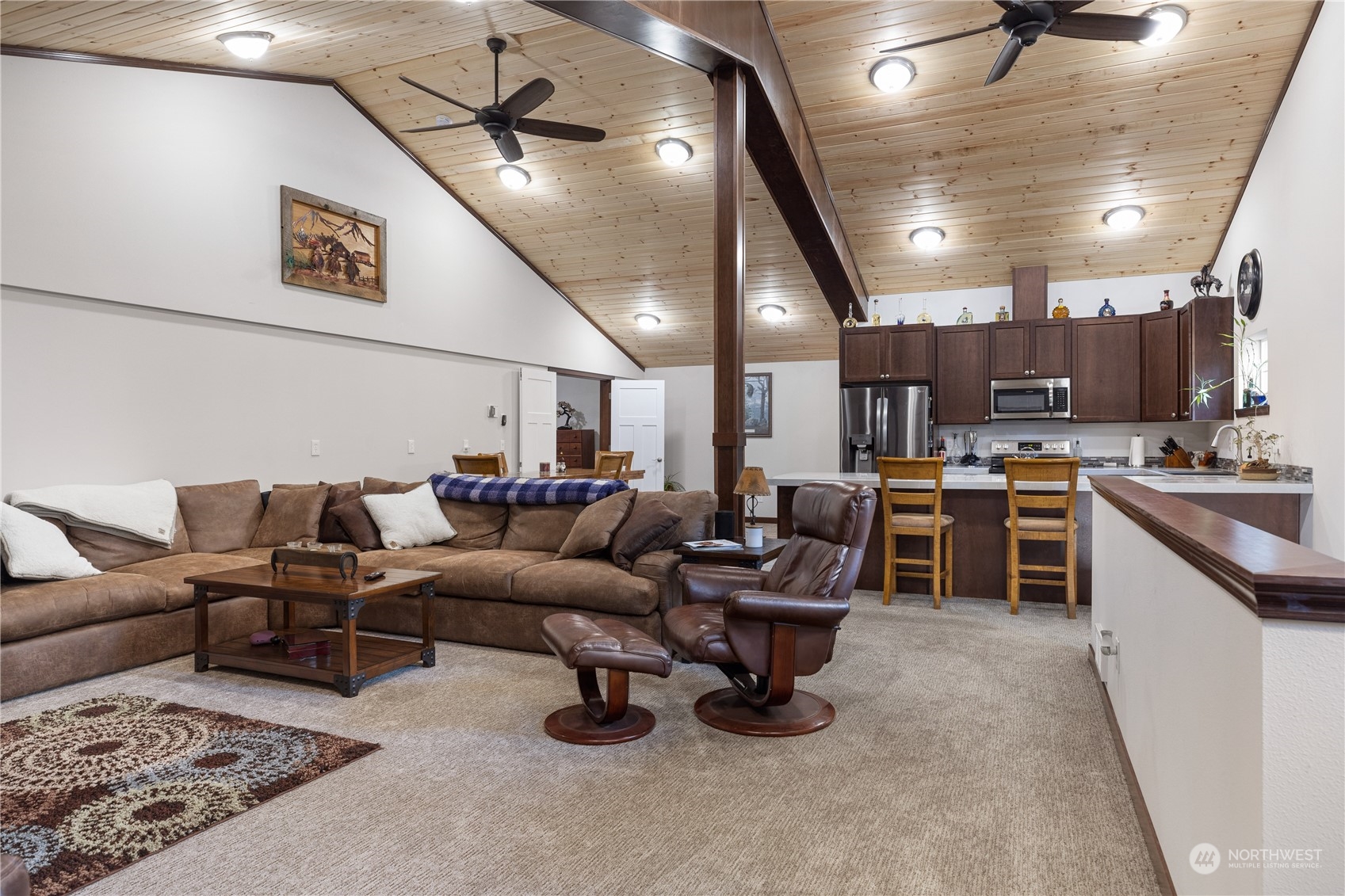 4656 Monkey Hill Road Oak Harbor, WA 98277 - Photo 38 of 40 a living room with lots of furniture and kitchen view