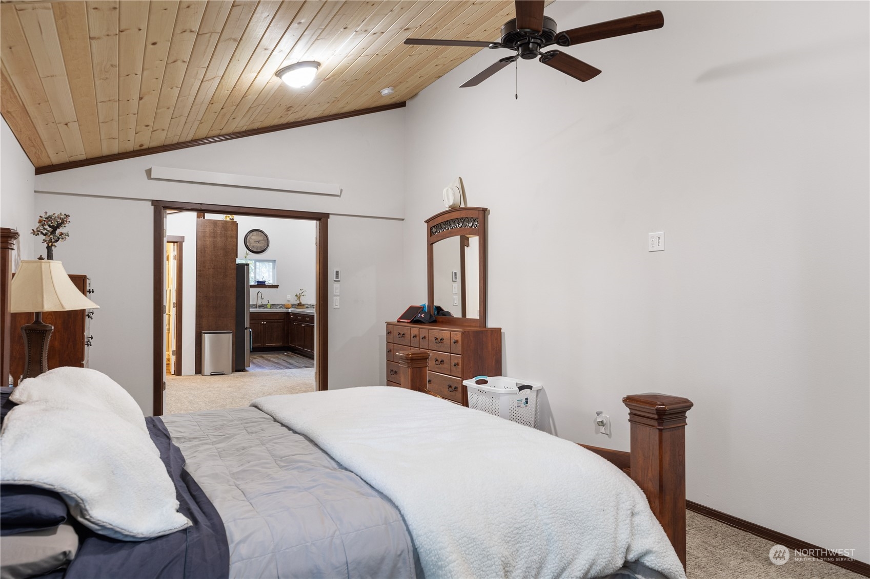 4656 Monkey Hill Road Oak Harbor, WA 98277 - Photo 40 of 40 a bedroom with a bed and a chandelier