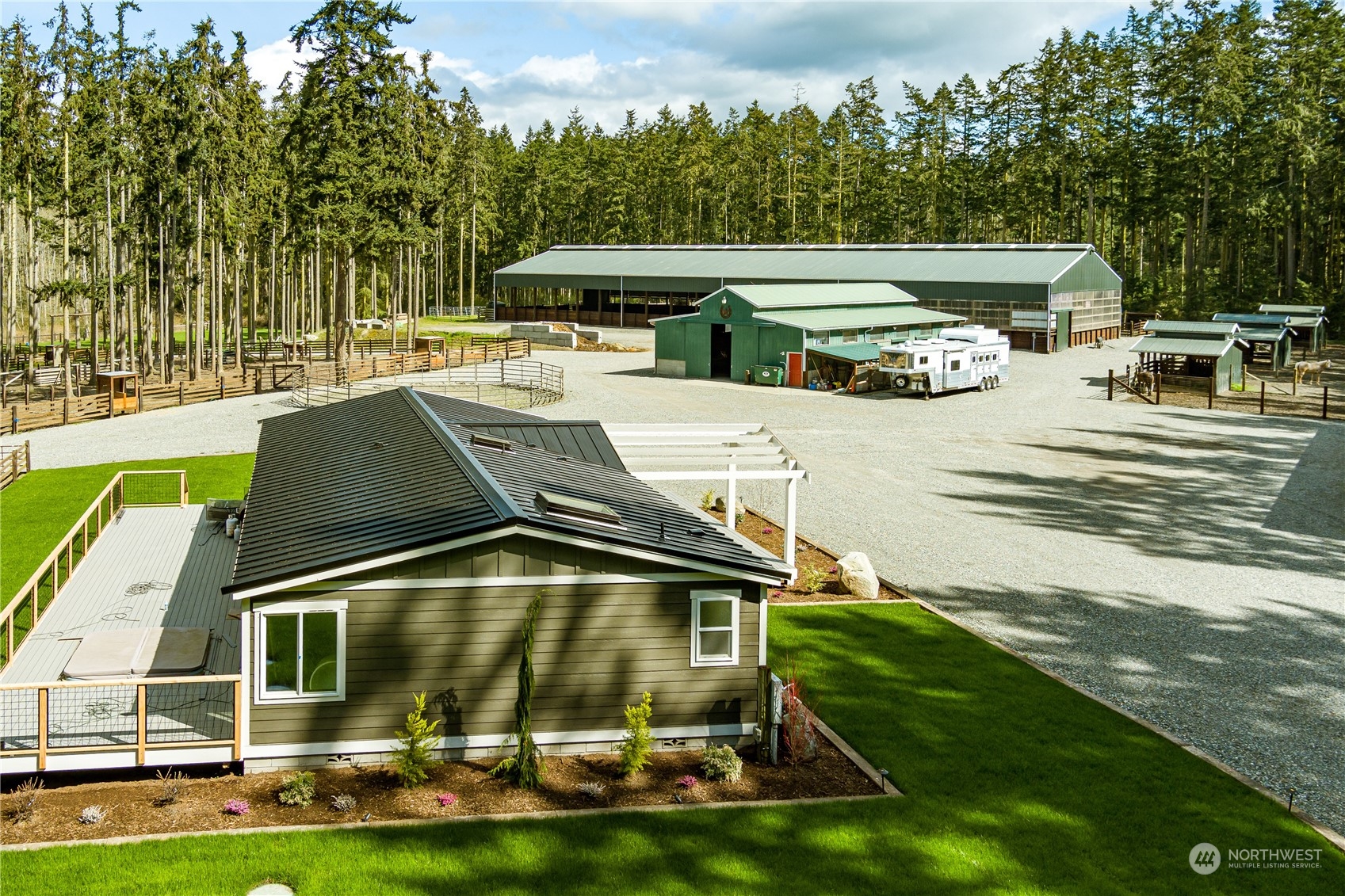 4656 Monkey Hill Road Oak Harbor, WA 98277 - Photo 5 of 40 a view of a patio with table and chairs with wooden floor and fence