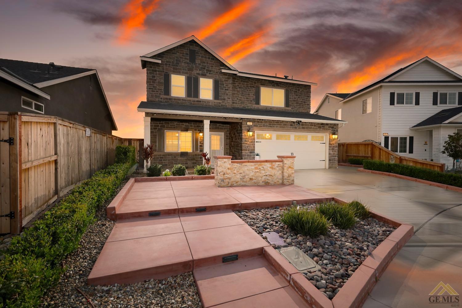 Undisclosed Address Shafter, CA 93263 - Photo 1 of 36 a front view of a house with garden