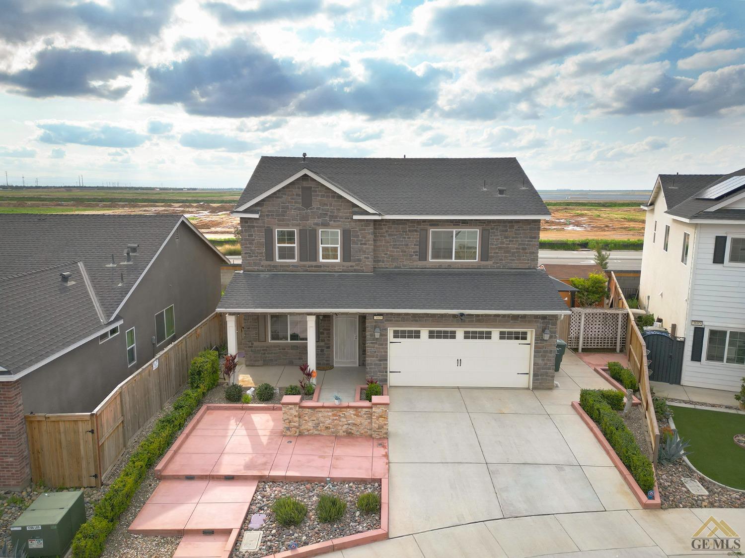 Undisclosed Address Shafter, CA 93263 - Photo 2 of 36 a front view of a house with a yard
