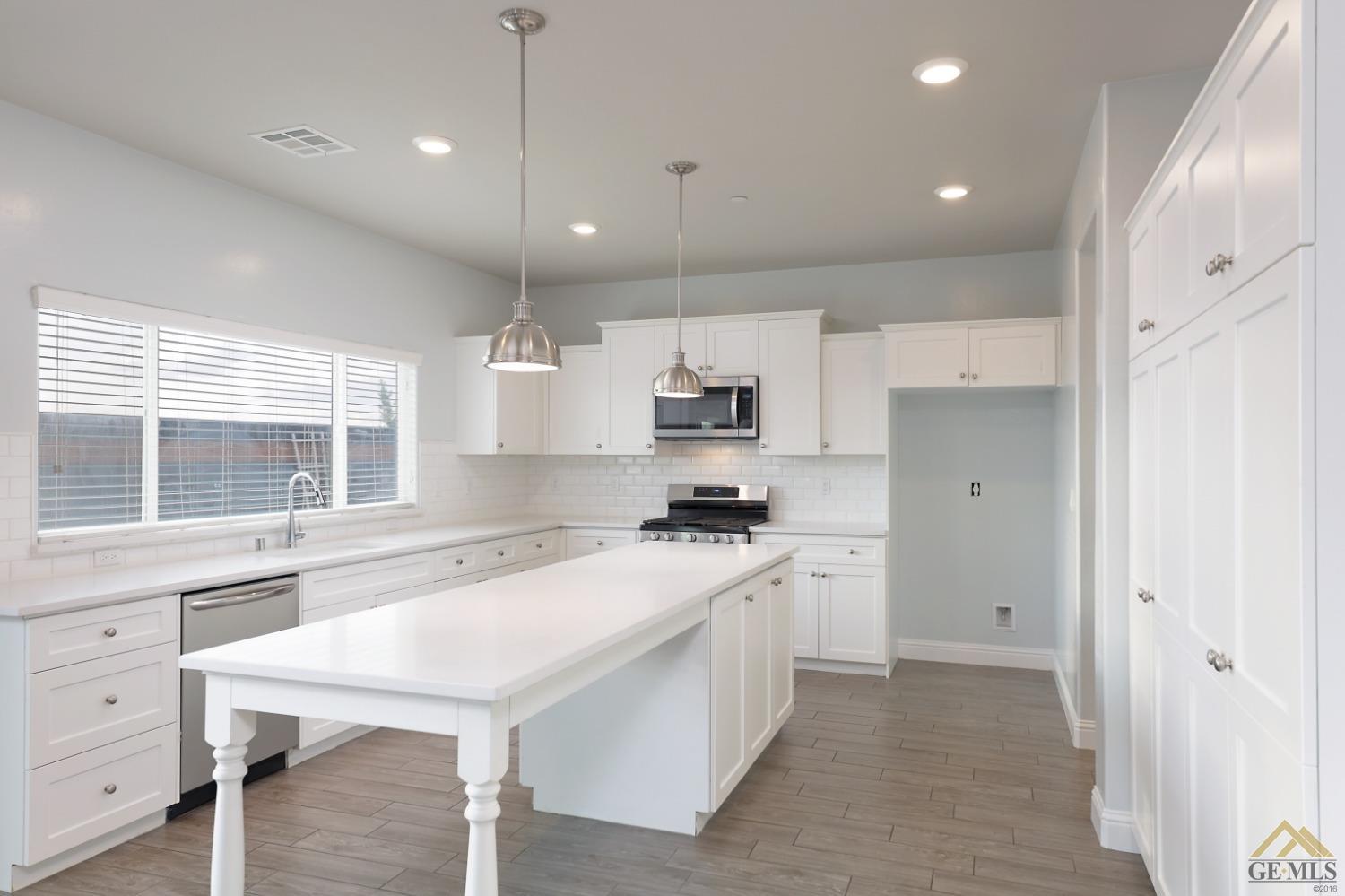 Undisclosed Address Shafter, CA 93263 - Photo 27 of 36 a kitchen with a sink stove and refrigerator
