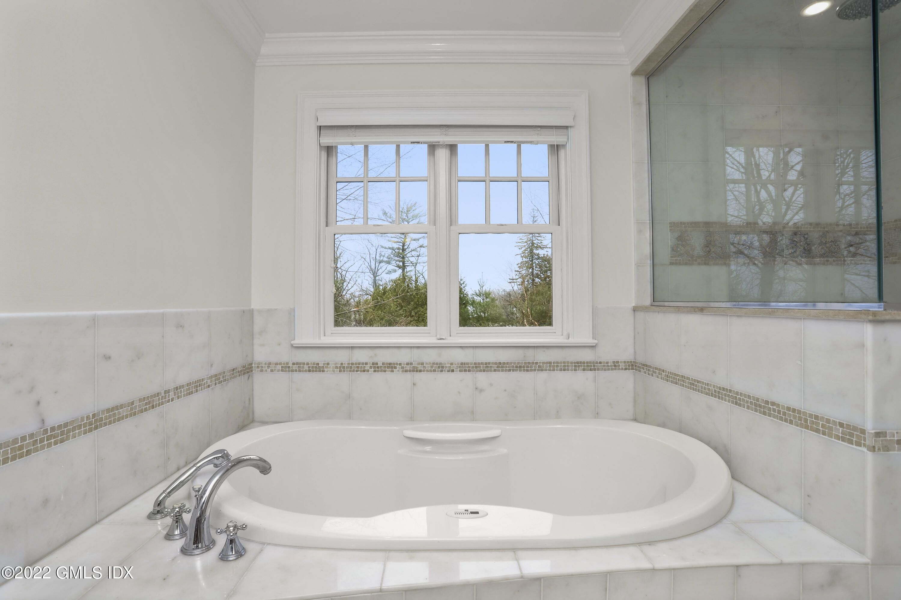 290 Riverside Avenue Riverside, CT 06878 - Photo 23 of 38 a white bath tub sitting in a bathroom next to a window