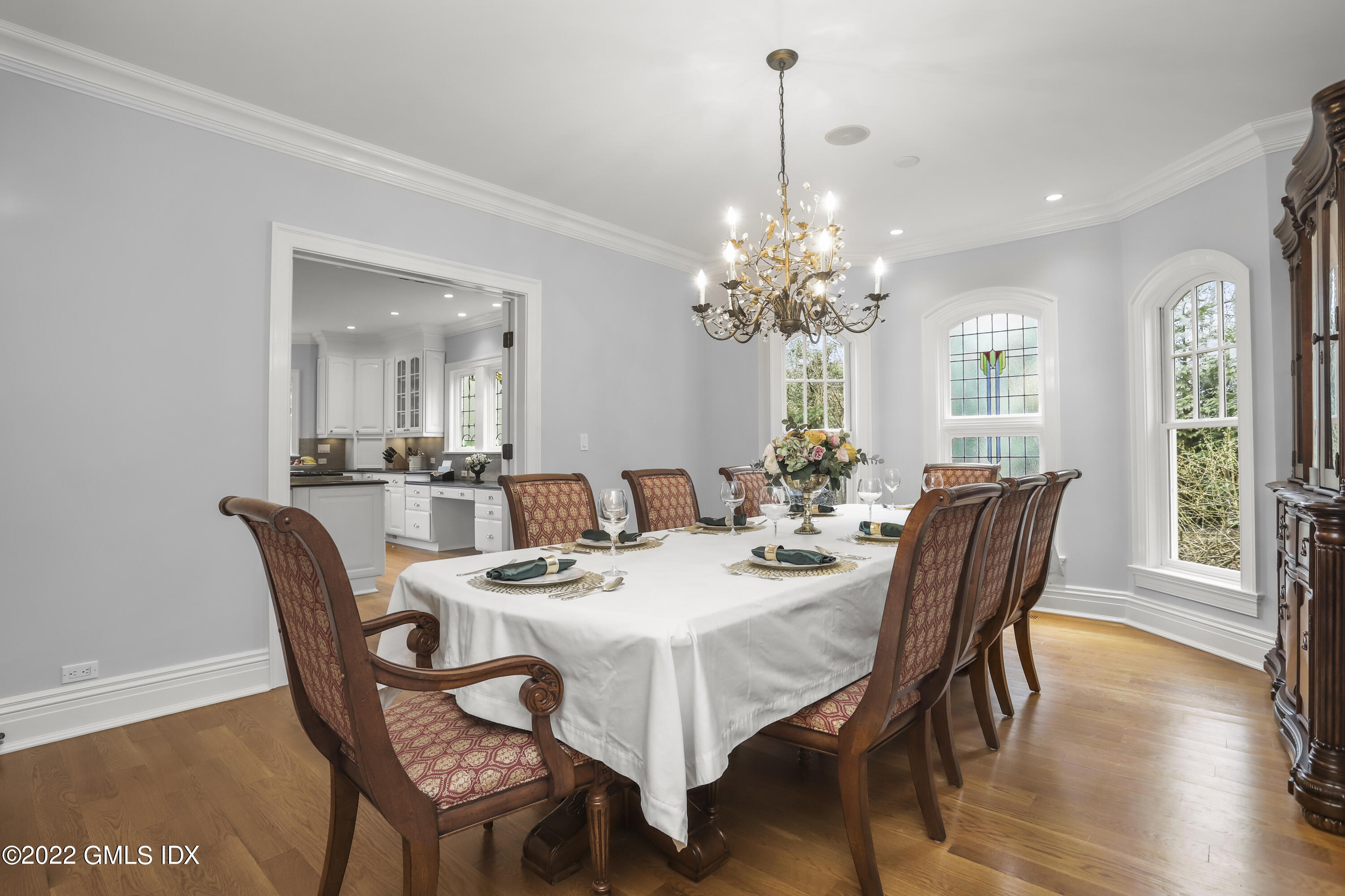 290 Riverside Avenue Riverside, CT 06878 - Photo 8 of 38 a dining room with furniture a chandelier and wooden floor