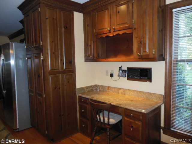 208 Rivers Bend Circle Chester, VA 23836 - Photo 16 of 24 Kitchen - There is granite topped built-in desk a