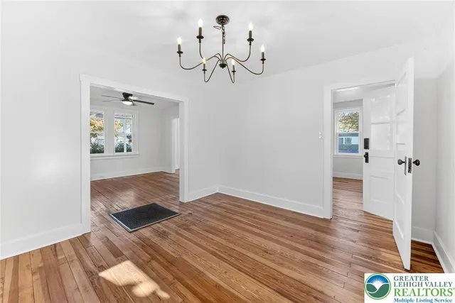 a view of empty room and wooden floor