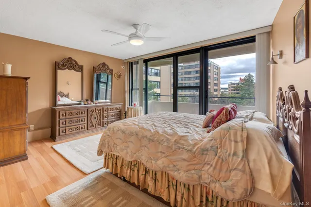 a bed sitting in a bedroom next to a large window