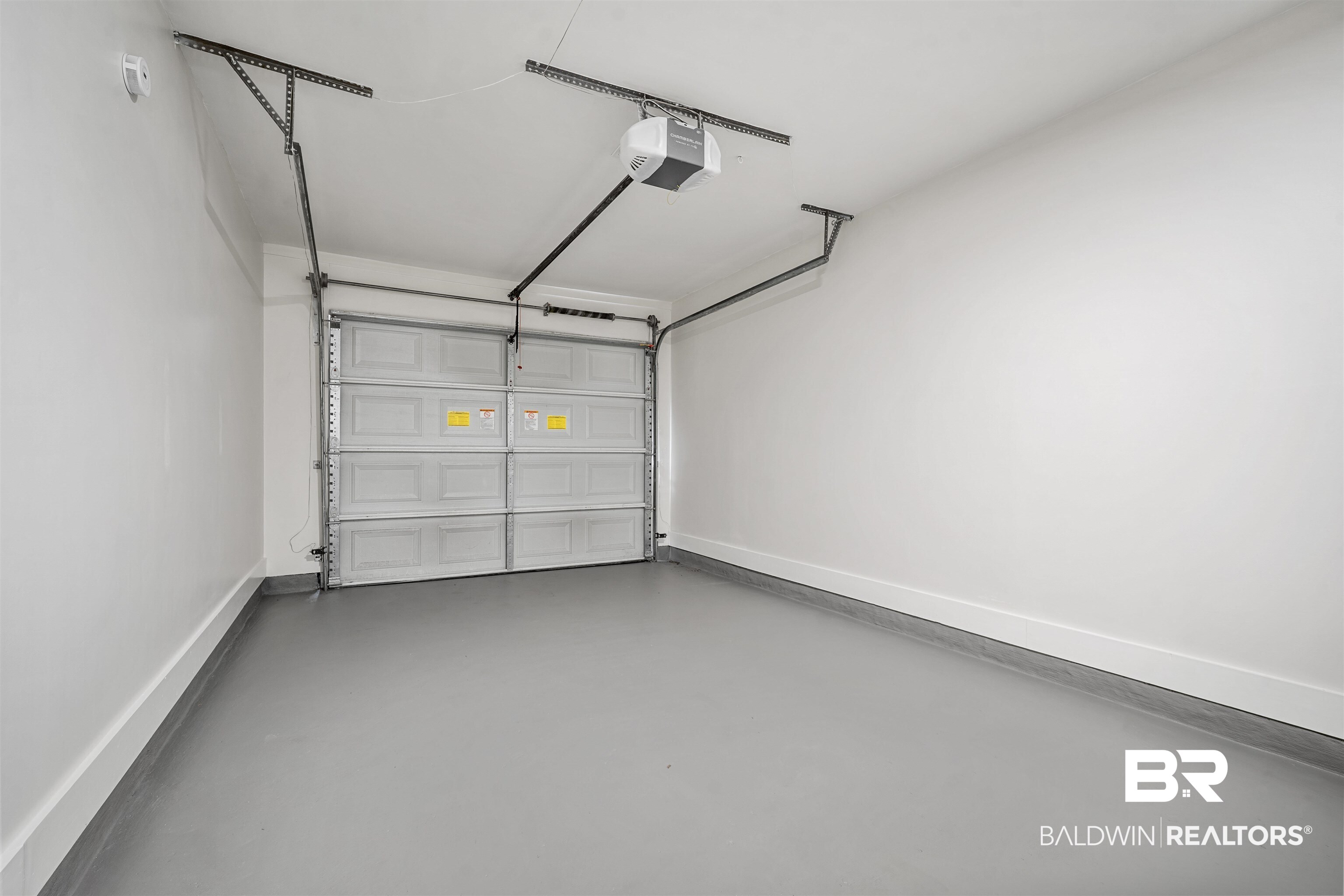 860 Montfort Road South Mobile, AL 36608 - Photo 24 of 27 Garage with baseboards and a garage door opener