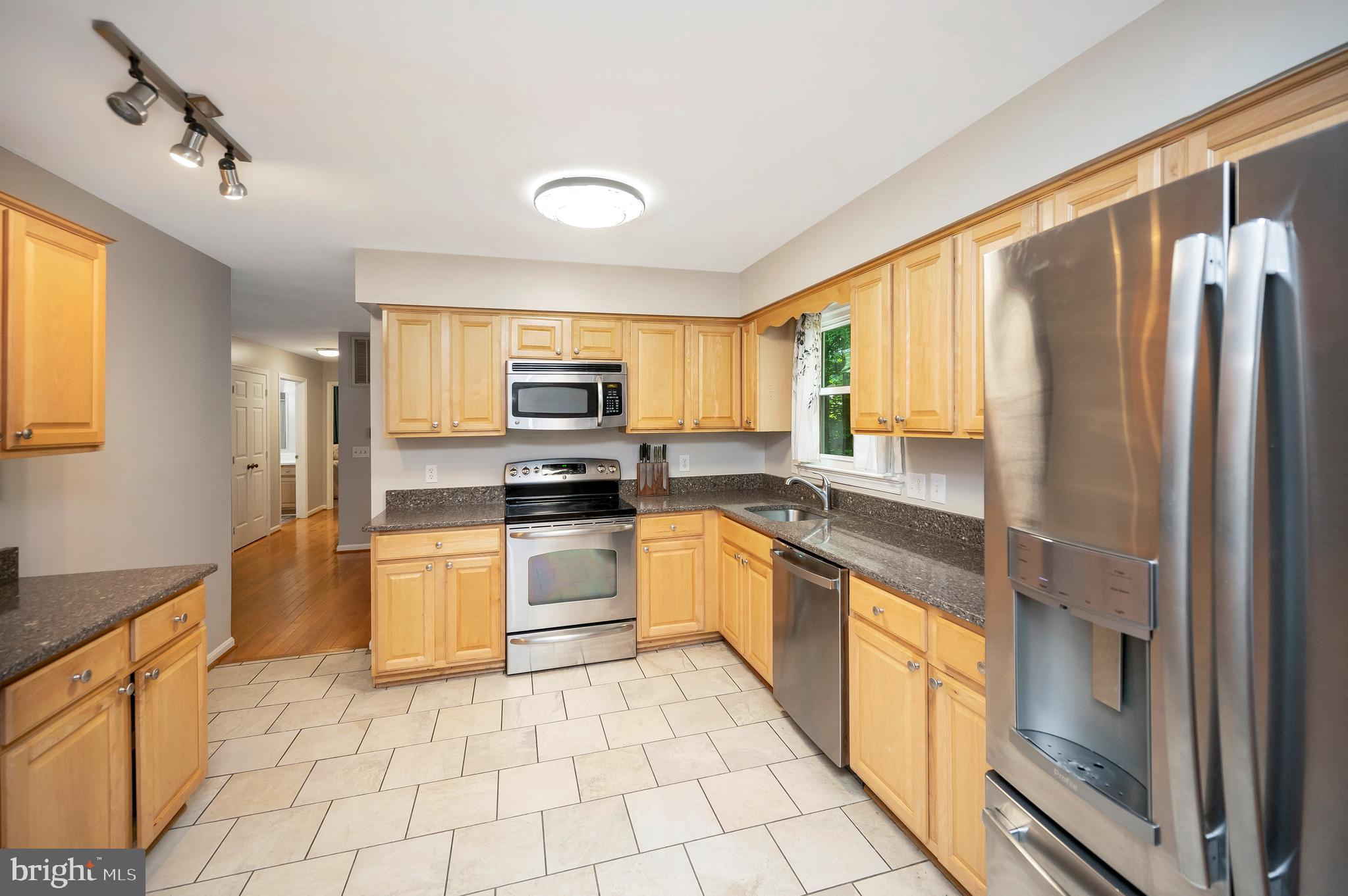 679 Cropp Road Fredericksburg, VA 22406 - Photo 15 of 39 a kitchen with stainless steel appliances granite countertop a refrigerator a stove top oven and sink