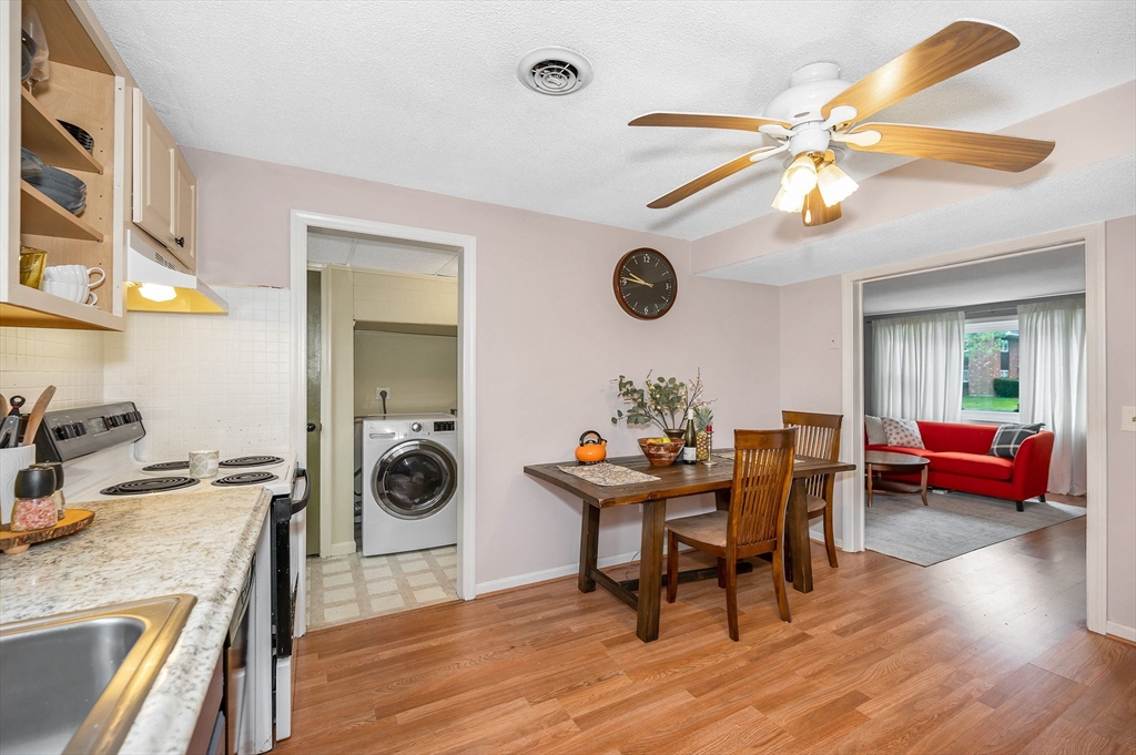 43 Constitution Way, Unit 43 Methuen, MA 01844 - Photo 10 of 25 a workspace with furniture and wooden floor
