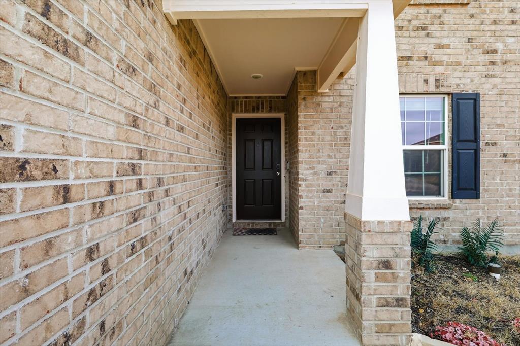 16041 Pious Drive Haslet, TX 76052 - Photo 2 of 36 Long porch leading to the front door