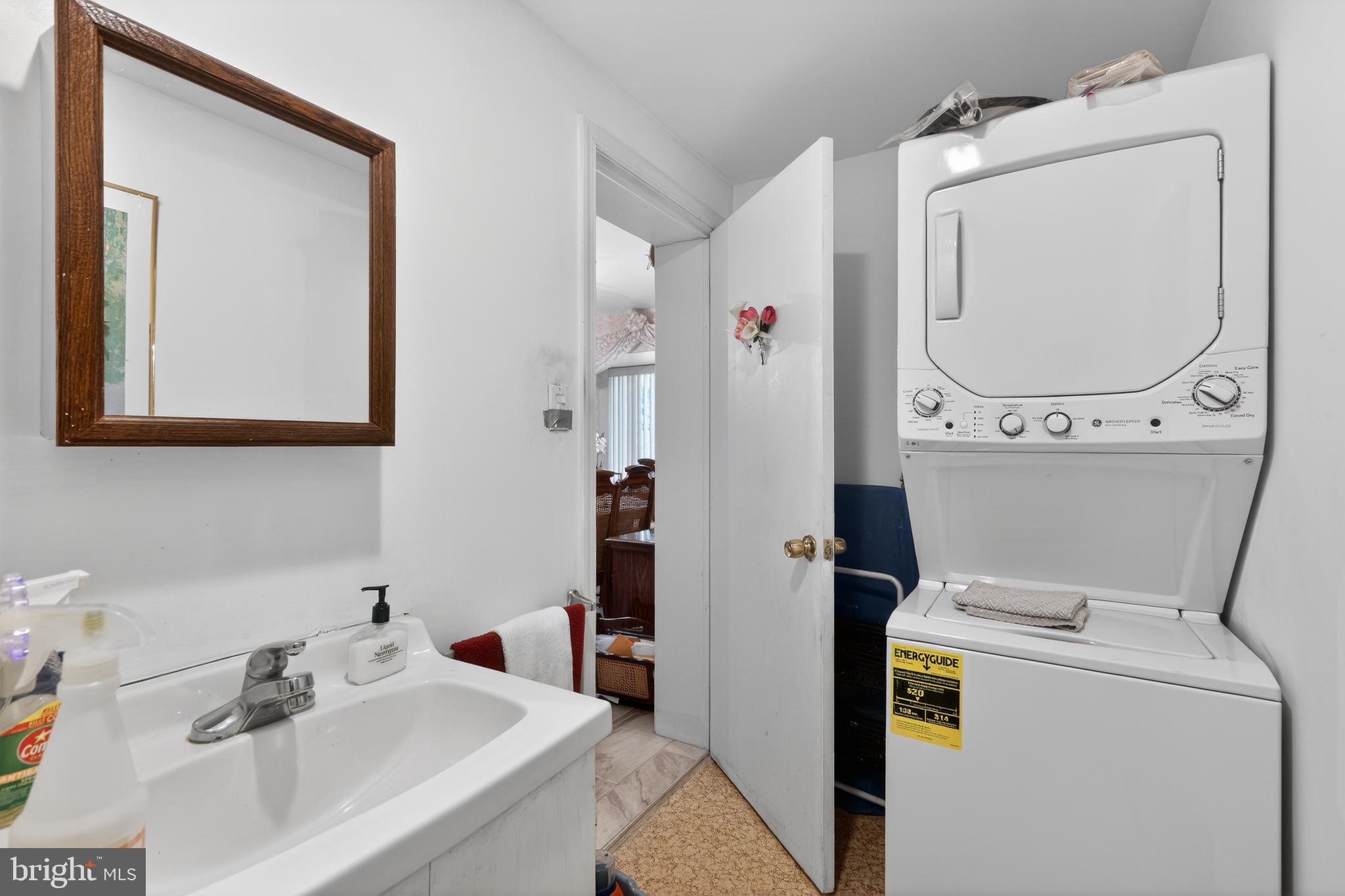 1424 Burmont Road Havertown, PA 19083 - Photo 15 of 37 a bathroom with a sink and a mirror
