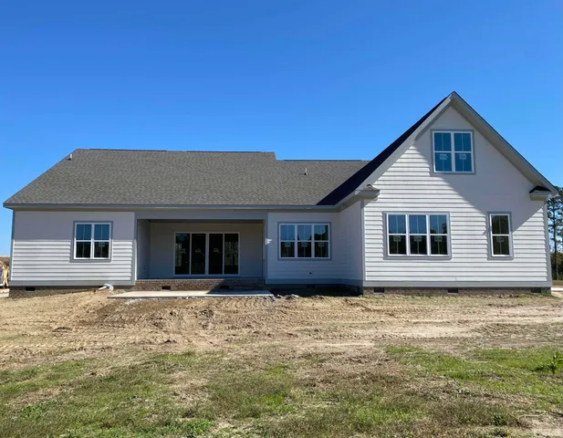 a house with trees in the background