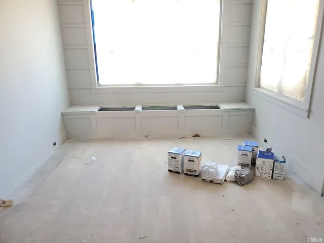 a bed room with a bed and a window