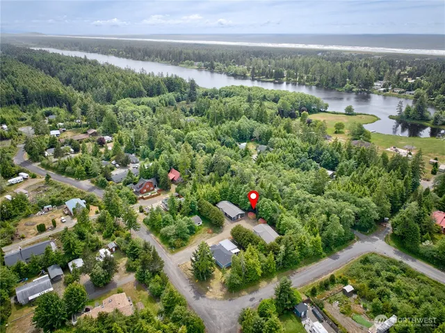 an aerial view of a house with a yard