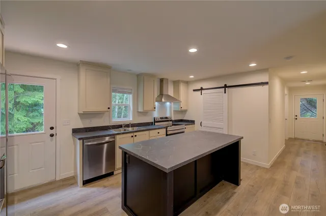 a kitchen with a stove and a sink