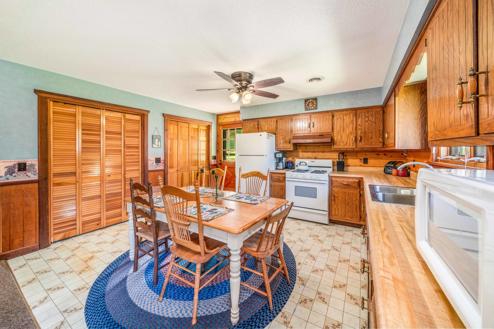 4151 Highway 2 Oregon, IL 61061 - Photo 13 of 30 a dining room with furniture a chandelier and wooden floor