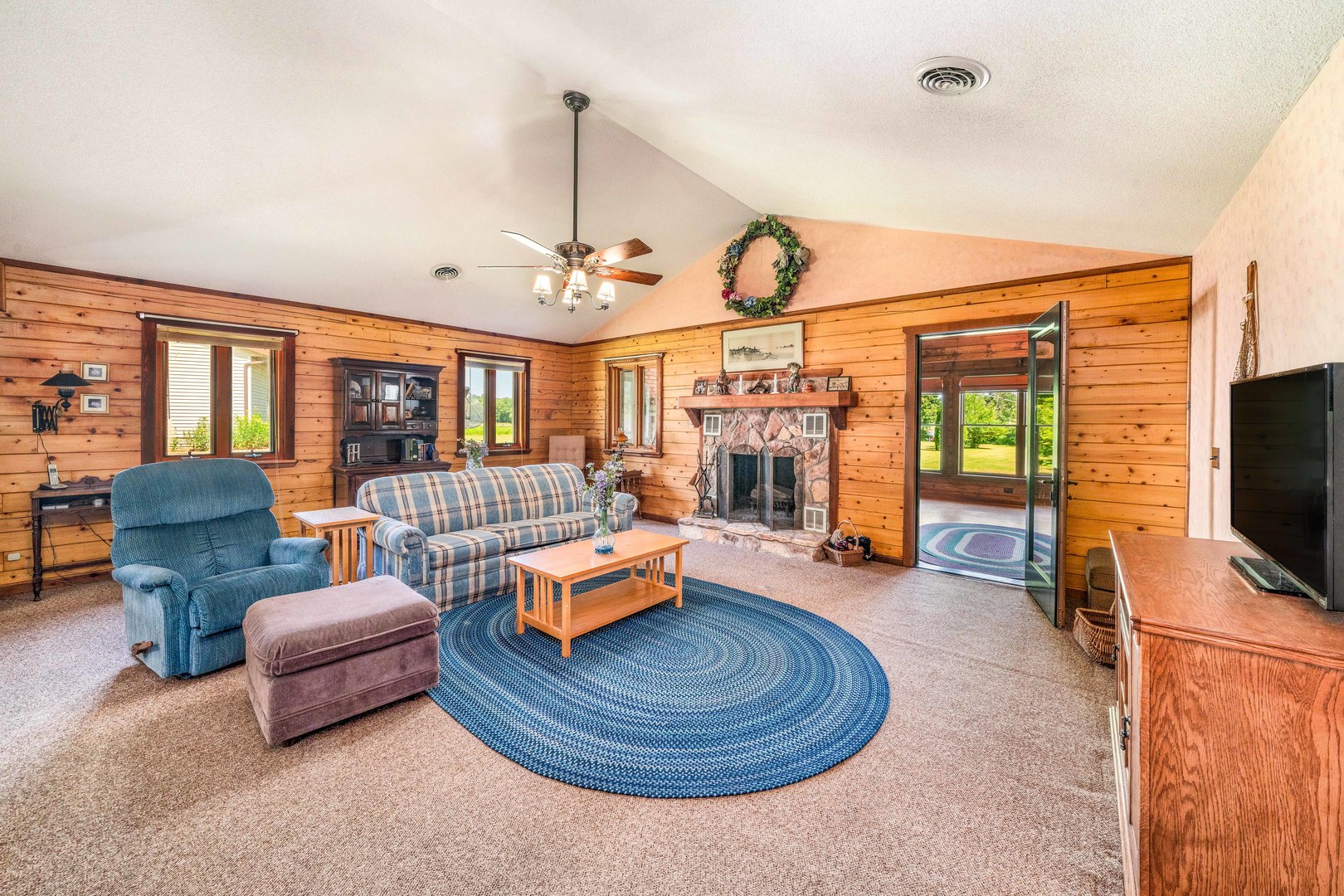 4151 Highway 2 Oregon, IL 61061 - Photo 15 of 30 a living room with furniture and a flat screen tv