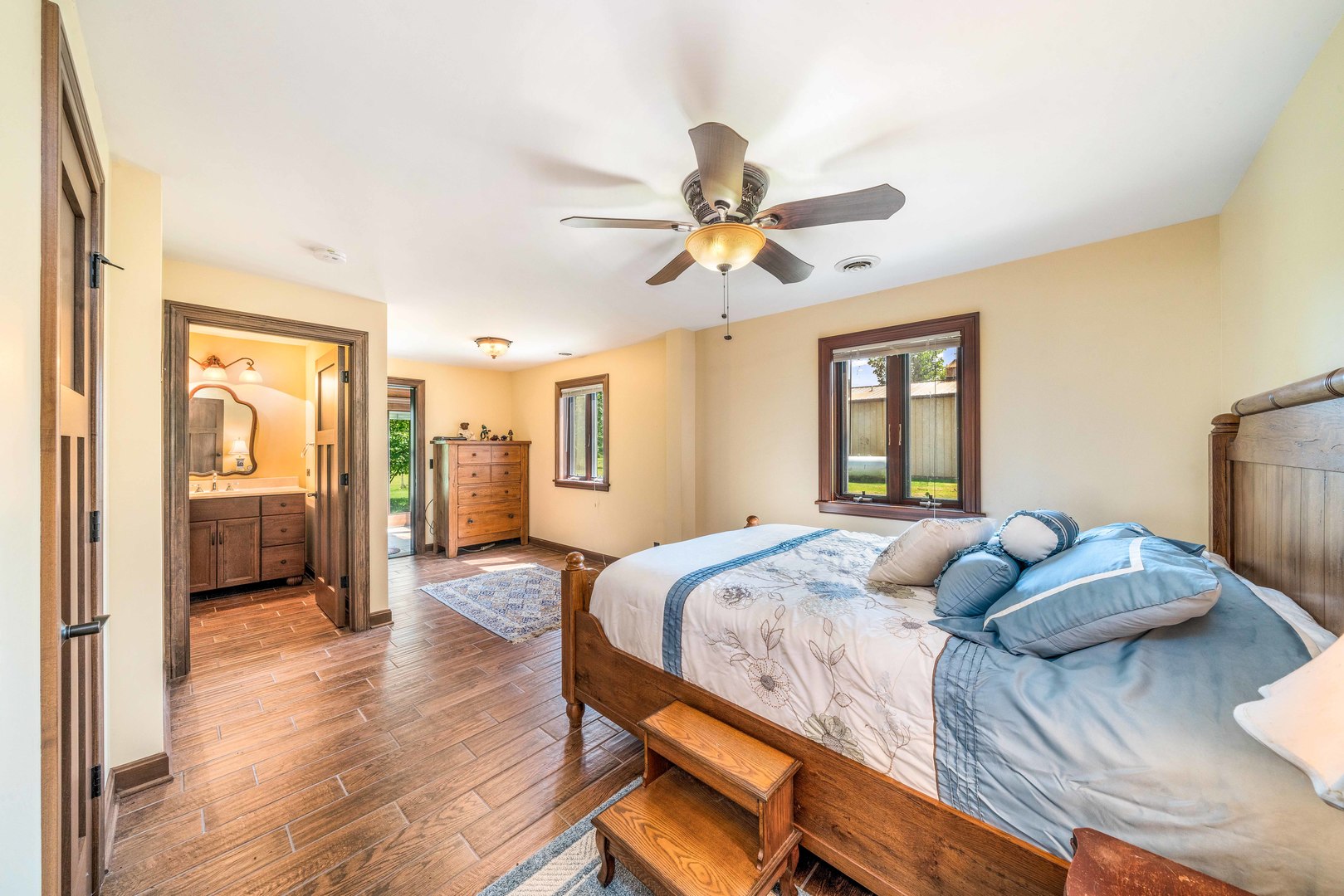 4151 Highway 2 Oregon, IL 61061 - Photo 21 of 30 a bedroom with a bed and a chandelier