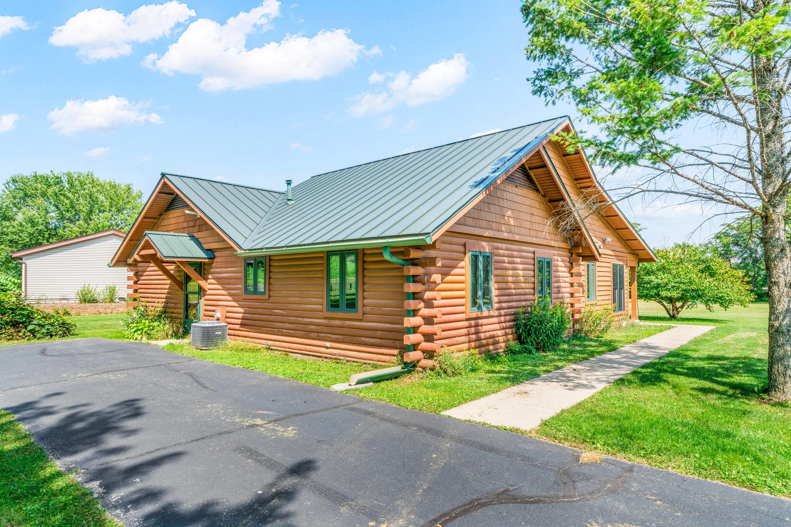 4151 Highway 2 Oregon, IL 61061 - Photo 8 of 30 a front view of a house with a yard and garage