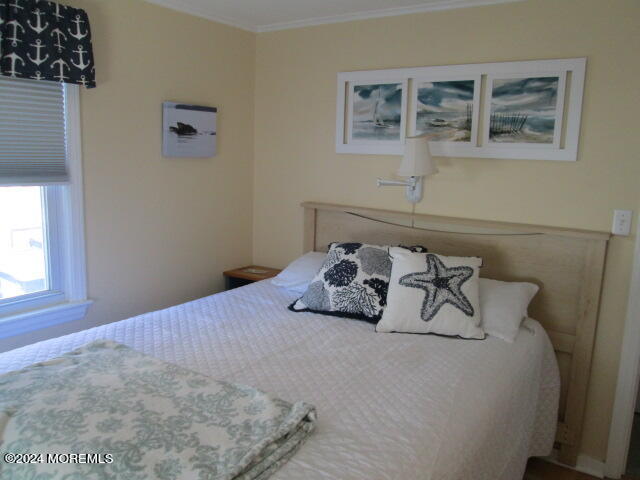 26 Malibu Road Lavallette, NJ 08735 - Photo 9 of 18 a bedroom with a bed and a window