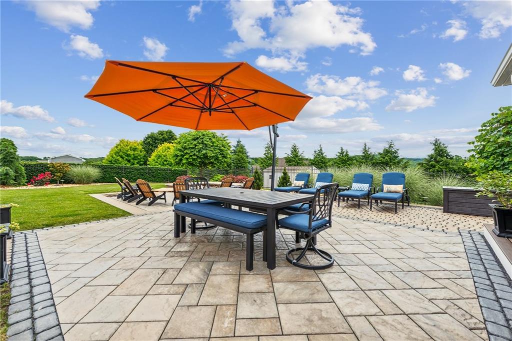 211 Huckleberry Road Indiana, PA 15701 - Photo 44 of 50 a view of a tables and chairs under an umbrella in a yard