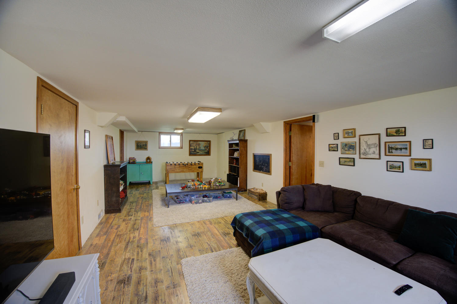 22245 Erickson Road Bend, OR 97701 - Photo 59 of 83 a living room with furniture and a flat screen tv