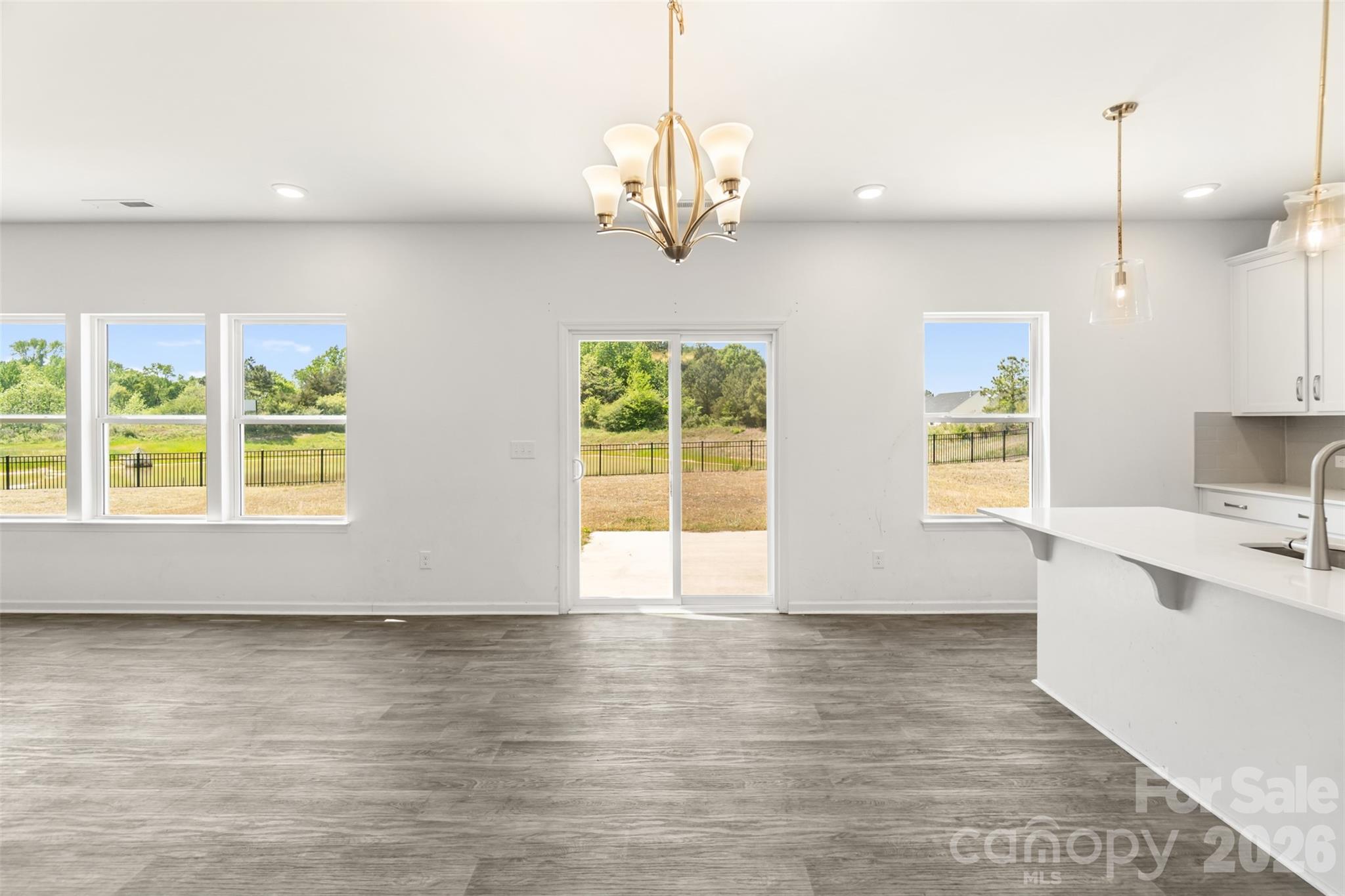 108 Aspire Circle Wingate, NC 28174 - Photo 11 of 31 a view of a kitchen with wooden floor and windows