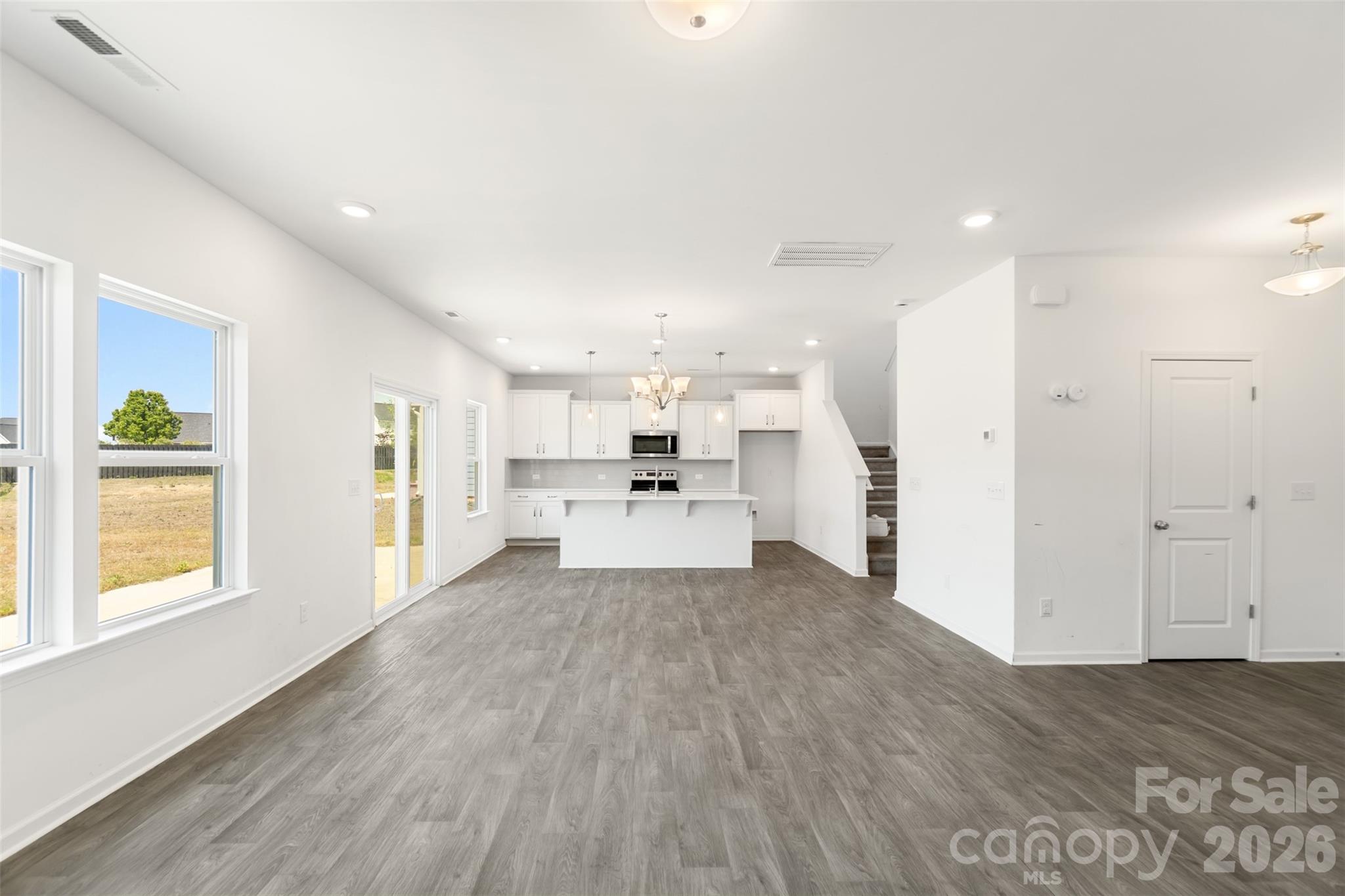 108 Aspire Circle Wingate, NC 28174 - Photo 12 of 31 a view of a kitchen with wooden floor and windows