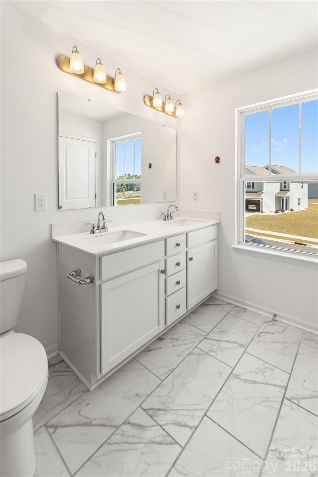 108 Aspire Circle Wingate, NC 28174 - Photo 21 of 31 a spacious bathroom with a sink toilet and mirror