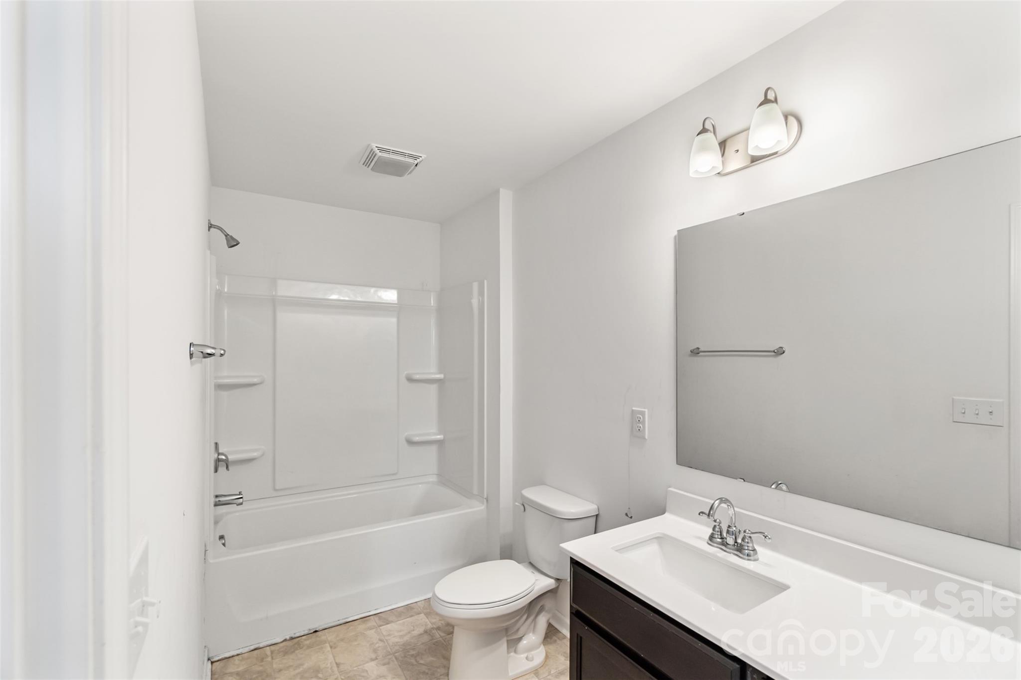 108 Aspire Circle Wingate, NC 28174 - Photo 26 of 31 a bathroom with a sink a toilet and a bathtub