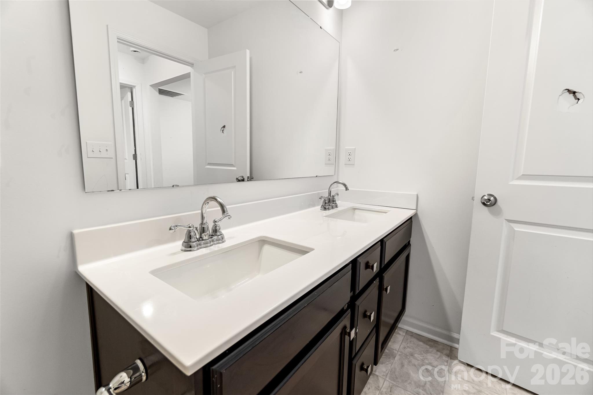 108 Aspire Circle Wingate, NC 28174 - Photo 27 of 31 a bathroom with a sink and a mirror