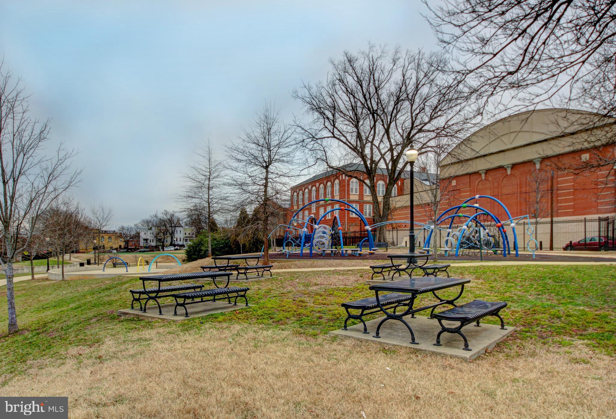 1117 Montello Avenue Northeast Washington, DC 20002 - Photo 61 of 64 a park bench sitting in the middle of a park