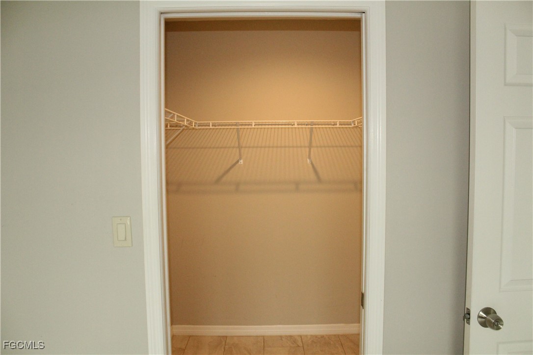 1110 Southwest 47th Terrace, Unit 102 Cape Coral, FL 33914 - Photo 8 of 13 a bathroom with a glass shower door