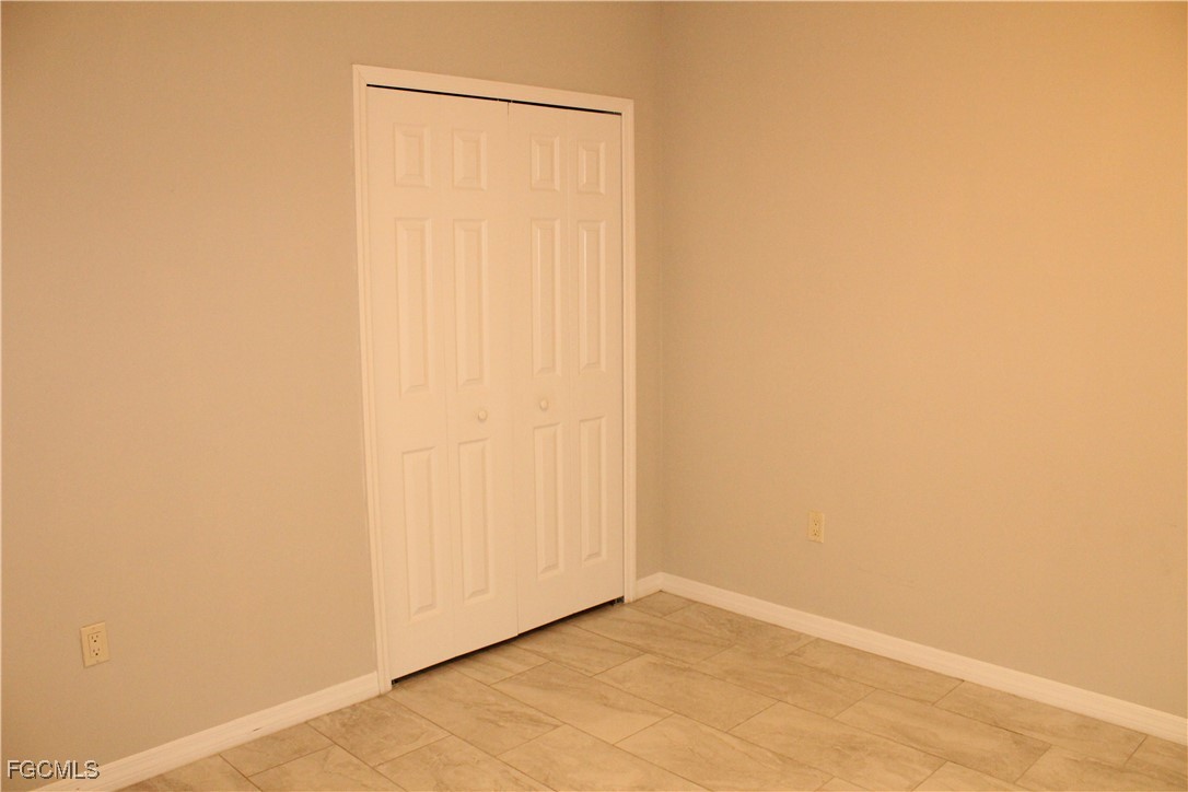 1110 Southwest 47th Terrace, Unit 102 Cape Coral, FL 33914 - Photo 10 of 13 a view of an empty room