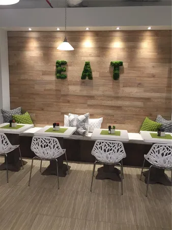 a kitchen with a table and chairs