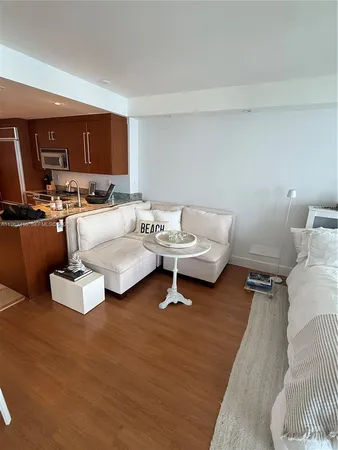 a kitchen with stainless steel appliances granite countertop a refrigerator stove and sink