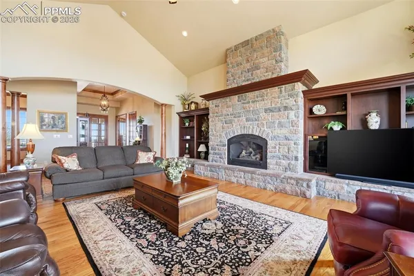 a kitchen with stainless steel appliances granite countertop a sink a stove and a refrigerator