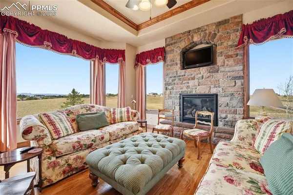 a spacious bedroom with a bed and a large window