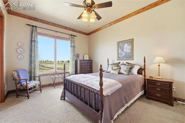 a room with furniture a rug and a chandelier