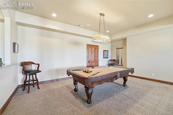 a large kitchen with a table and chairs