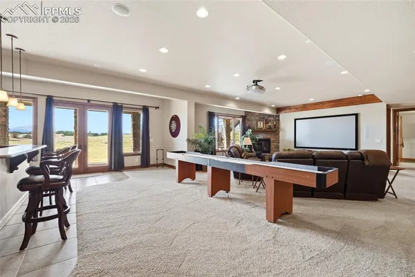 a bedroom with a bed dresser and a window