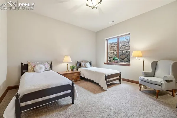 a living room with lots of furniture and kitchen view