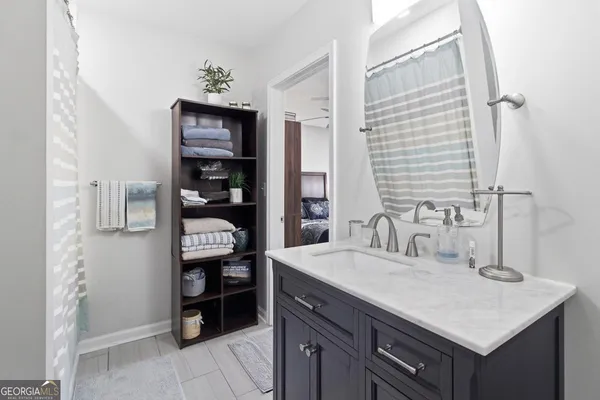 a bathroom with a sink a vanity and a mirror