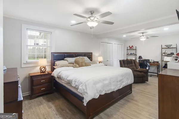 a bedroom with bed and window