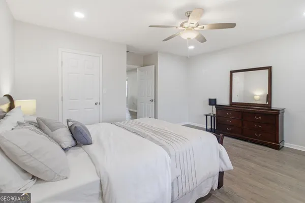 a bedroom with a bed and a dresser