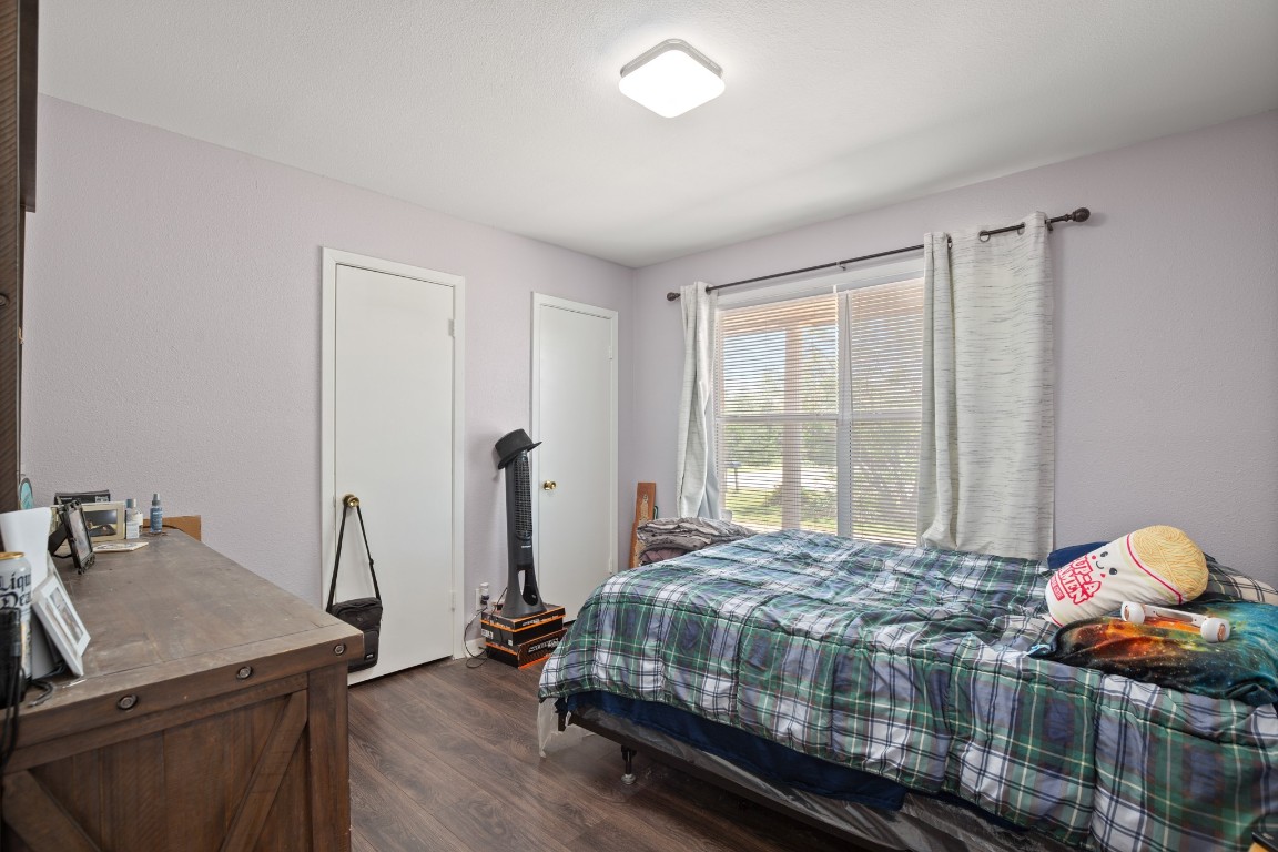 101 Homestead Road Kyle, TX 78640 - Photo 11 of 29 a bedroom with a bed and dresser
