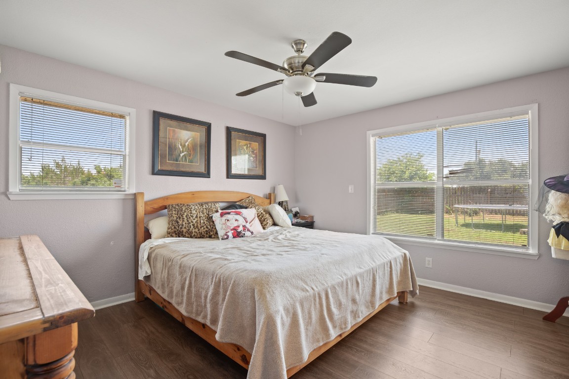 101 Homestead Road Kyle, TX 78640 - Photo 14 of 29 a bedroom with a large bed and a window
