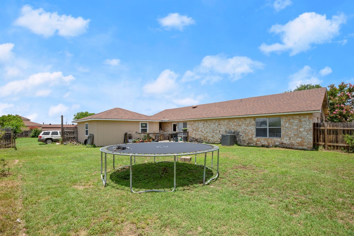 101 Homestead Road Kyle, TX 78640 - Photo 18 of 29 a view of a house with a yard and sitting area