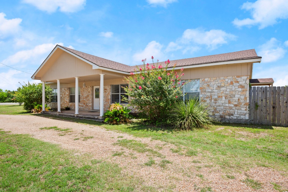 101 Homestead Road Kyle, TX 78640 - Photo 3 of 29 a view of a house with backyard and garden